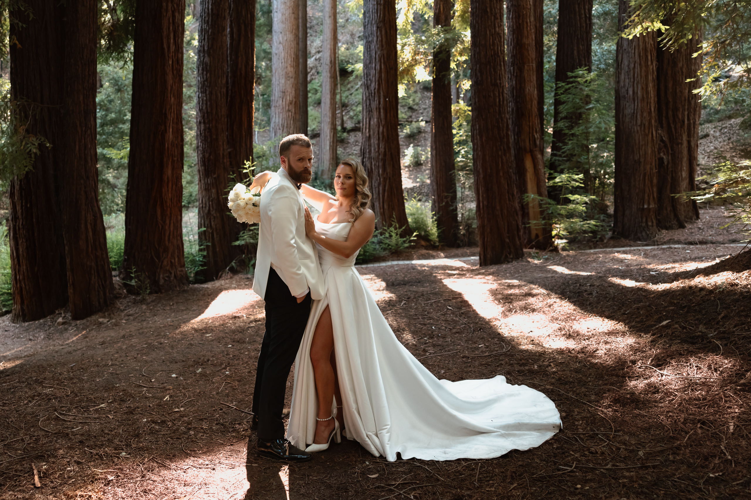 Husband and Wife Standing in the Redwoods forest in California for their spouse portraits