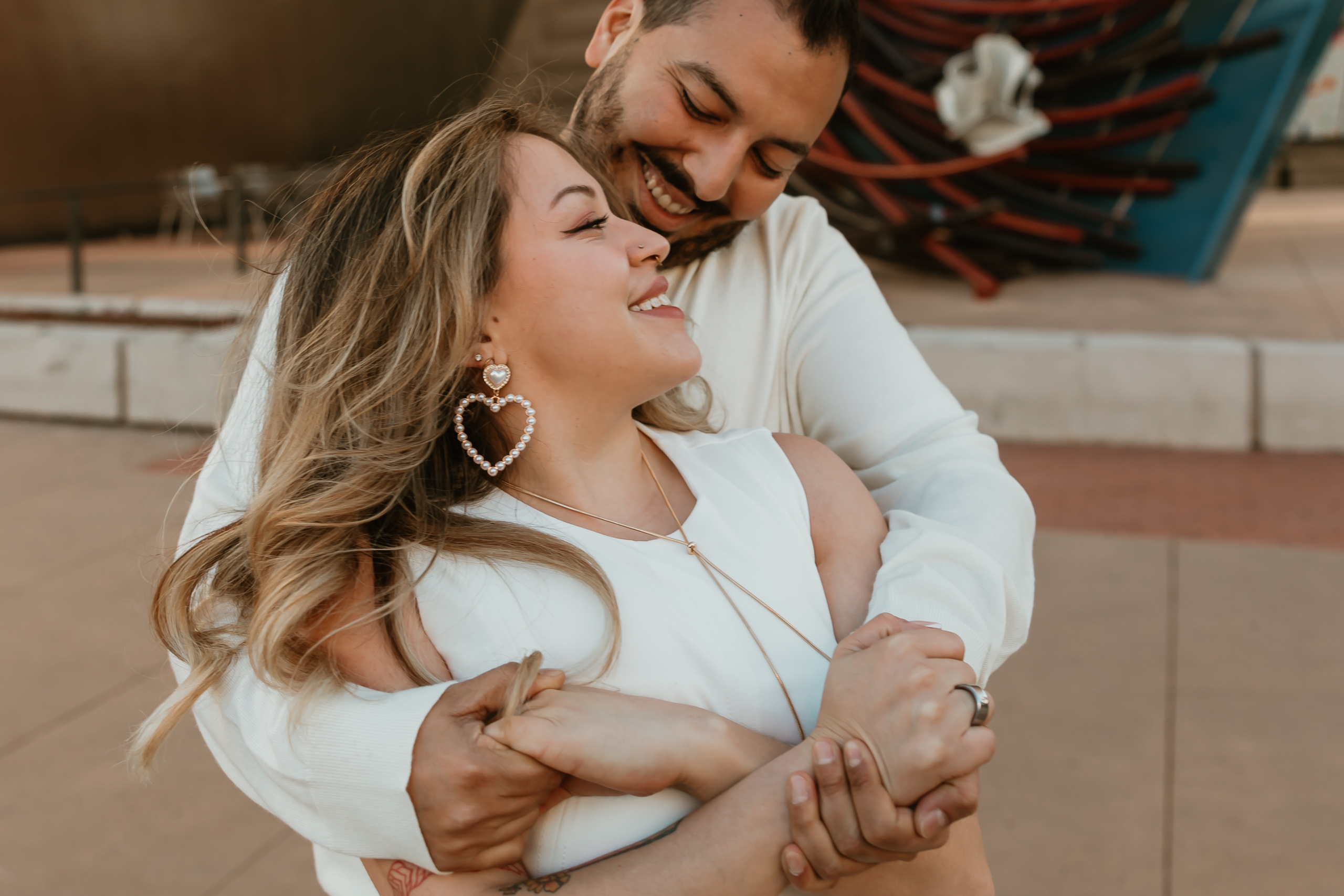 Couple embracing for their Denver Art Museum Engagement Photos